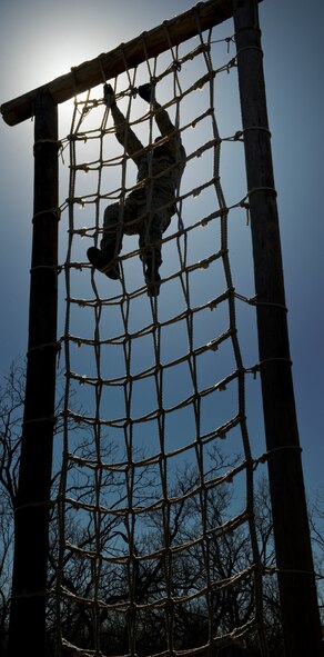 U.S. Air Force Airman 1st Class Terrance Branch, 7th Aircraft Maintenance Squadron, participates in one of 32 obstacle courses March 24, 2012, at the Warren Dodson training complex in Abilene, Texas. The course was hosted by the Airman Advisory Council to boost morale while supporting physical fitness. (U.S. Air Force photo by Airman 1st Class Jonathan Stefanko/ Released)