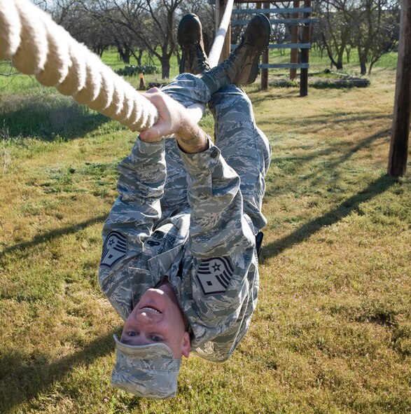 U.S. Air Force Master Sgt. Christopher Krieger, 7th Medical Group first sergeant, participates in one of 32 obstacle courses March 24, 2012, at the Warren Dodson training complex in Abilene, Texas. The course was hosted by the Airman Advisory Council to boost morale while supporting physical fitness. (U.S. Air Force photo by Airman 1st Class Jonathan Stefanko/ Released)
