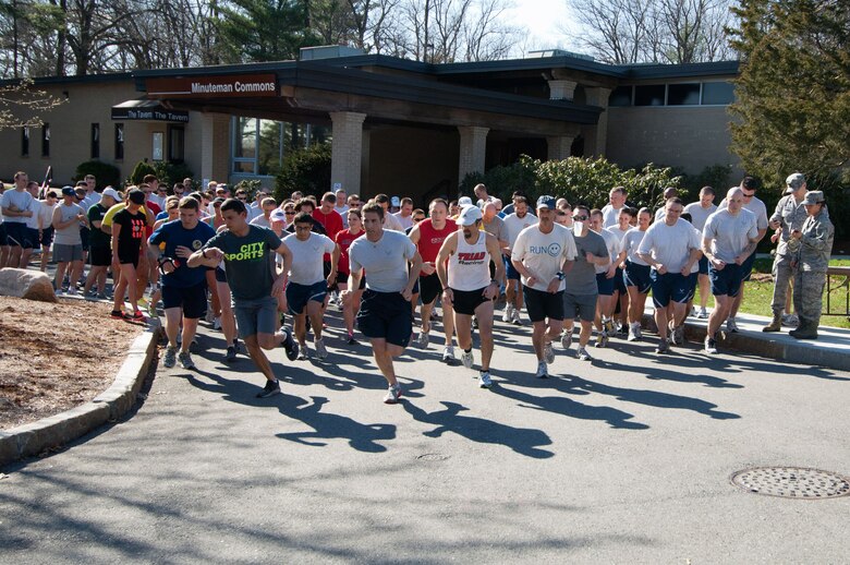HANSCOM AIR FORCE BASE, Mass. – Runners take off during the Company Grade Officers Council-sponsored 5K/10K run held March 22 to help raise money for the Air Force Assistance Fund. The AFAF campaign runs until May 4 and helps provide for the well-being of active duty and retired Airmen and their families. Fundraising events will be held throughout the campaign. (U.S. Air Force photo by Rick Berry)