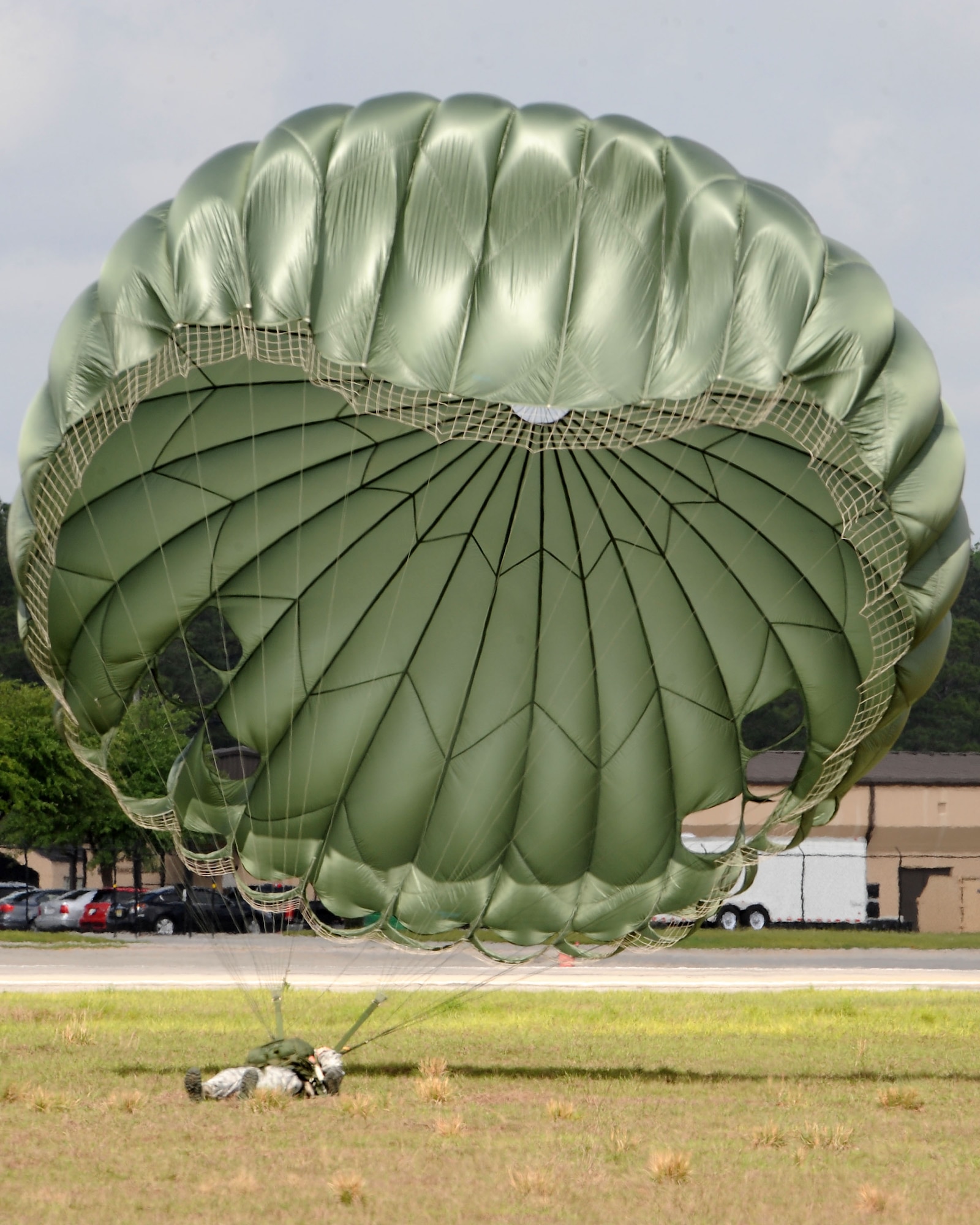 U.S. Air Force Senior Airman Shalonna Lisle, 822nd Base Defense Squadron fire team member, comes to rest after landing at a drop zone at Moody Air Force Base, Ga., March 21, 2012. A drop zone is an area where parachutists or parachuted materials land. (U.S. Air Force photo by Staff Sgt. Ciara Wymbs/Released) 
