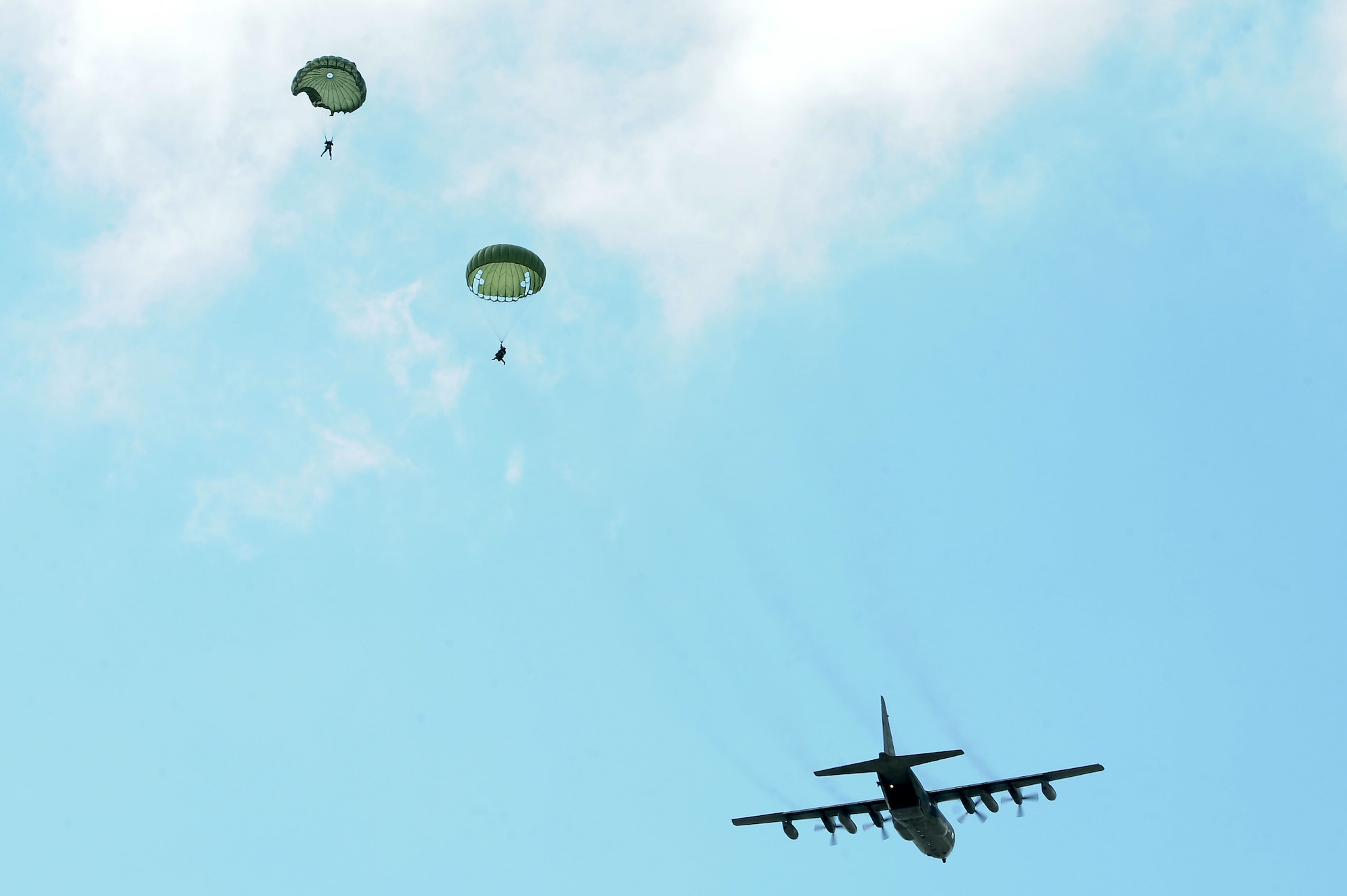 U.S. Air Force Airmen from the 820th Base Defense Group descend to a drop zone at Moody Air Force Base, Ga., March 21, 2012. Members on jump status are required to keep current on their training to remain jump qualified. (U.S. Air Force photo by Staff Sgt. Ciara Wymbs/Released)   