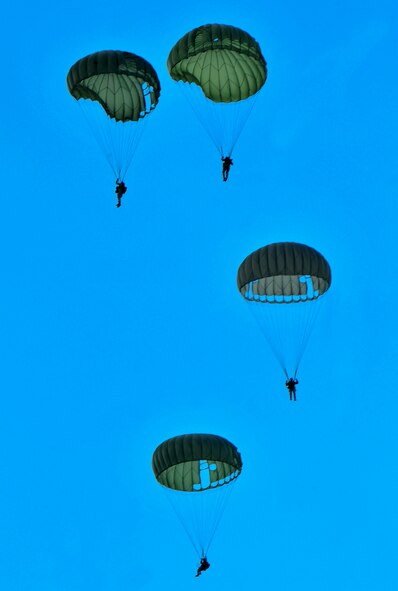 U.S. Air Force members from the 820th Base Defense Group, parachute from a HC-130P Combat King at Moody Air Force Base, Ga., March 21, 2012. Approximately 30 Airmen participated in a static line jump from a C-130 to maintain their currency. (U.S. Air force photos by Staff Sgt. Stephanie Mancha/Released)
