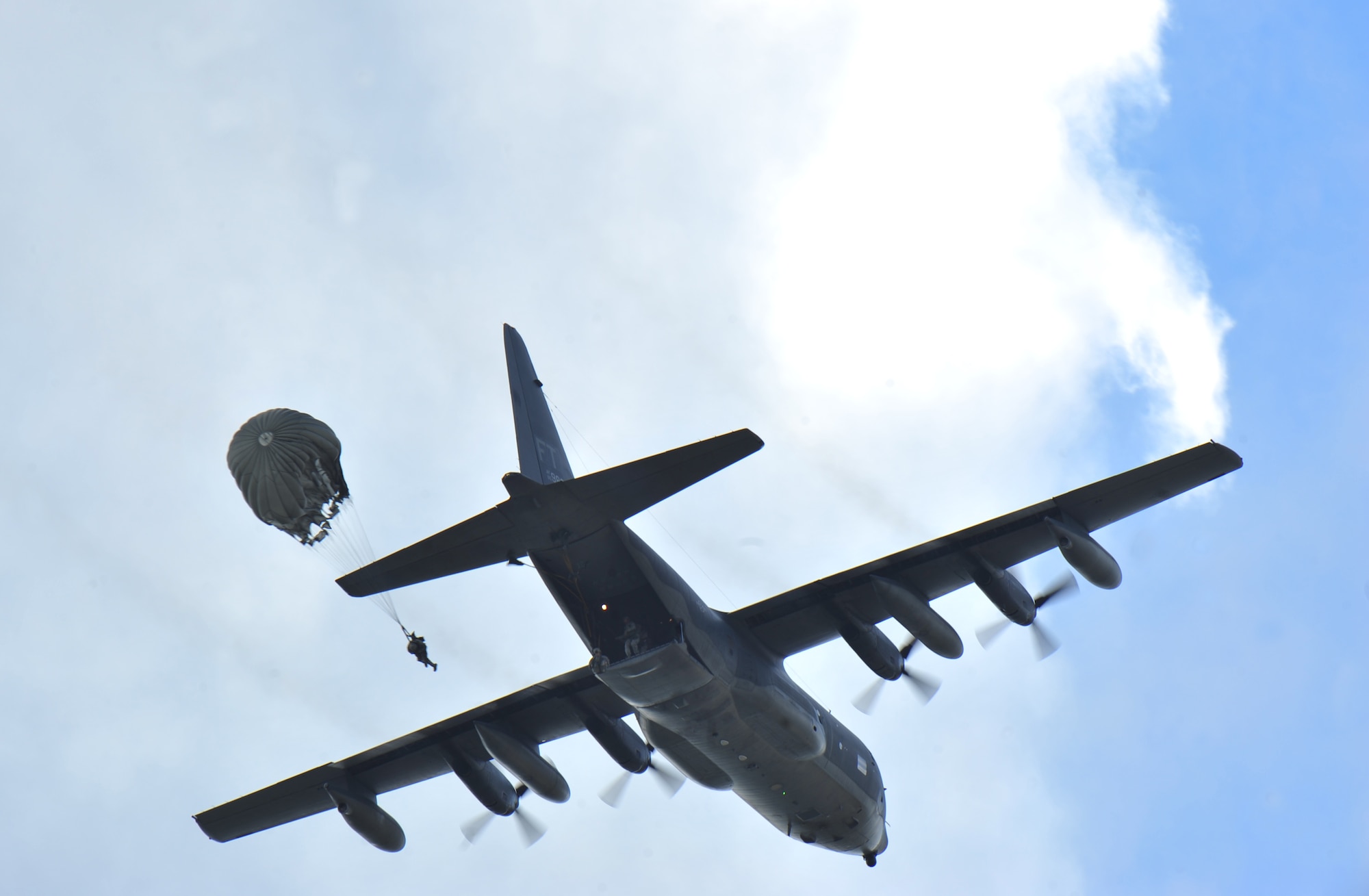 A U.S. Air Force member from the 820th Base Defense Group, jumps out of an HC-130P Combat King at Moody Air Force Base, Ga., March 21, 2012. Approximately 110 Airmen in the 820th BDG are airborne qualified and able to perform a full-spectrum of operation skills during a parachute assault. (U.S. Air force photos by Staff Sgt. Stephanie Mancha/Released)
