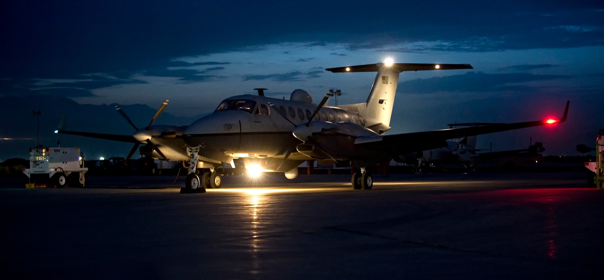An MC-12 sits on the parking ramp at night. Capt. Robert Madson, a pilot with the 351st Air Refueling Squadron, spent six months flying an MC-12, used by the Air Force for intelligence, surveillance and reconnaissance missions. Usually a co-pilot, Madson took on the role of the main pilot as the aircraft commander focused on the ground and reconnaissance missions. (Courtesy photo)