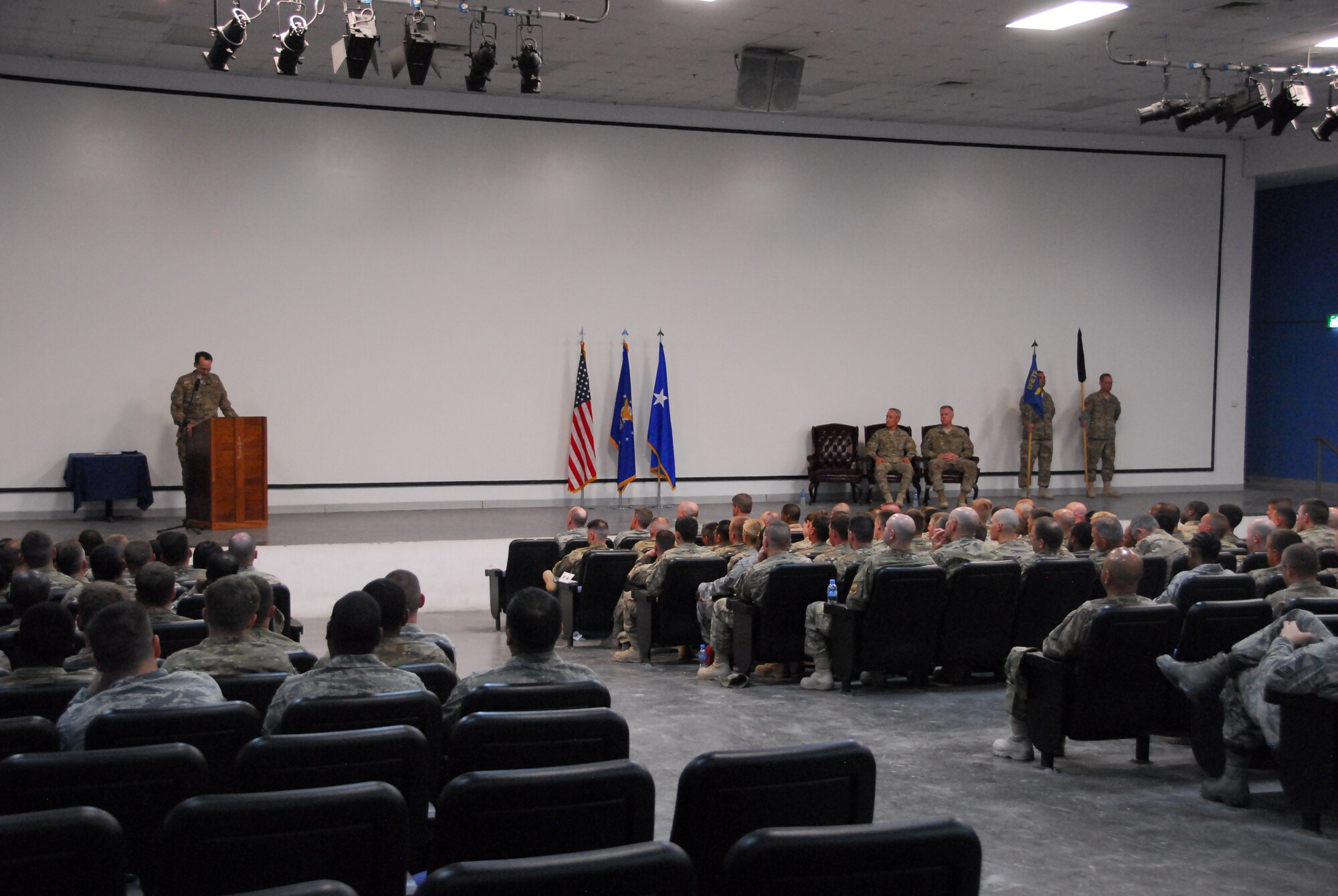 The 1st Expeditionary RED HORSE Group is redesignated the 1st Expeditionary Civil Engineer Group in a ceremony here March 26, 2012. The ceremony included a change of command, from Col. Darren Daniels to Col. John Allen. Maj. Gen. James Jones, U.S. Air Forces Central deputy commander, presided over the event. (U.S. Air Force Photo/Staff Sgt. Nicole Manzanares)