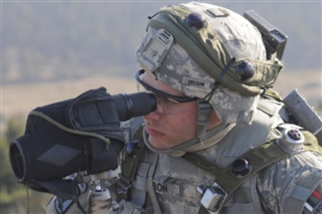 U.S. Army Spc. Zachary Dixson, with the 173rd Airborne Brigade Combat Team uses a spotting scope to watch for simulated enemy combatants during an exercise at the Joint Multinational Readiness Center in Hohenfels, Germany, on March 21, 2012.  The training was part of a mission rehearsal exercise conducted by the 173rd Airborne Brigade in preparation for a deployment to Afghanistan.  The exercise is intended to develop combat skills, counterinsurgency tactics and multinational partnerships among forces of the United States, Albania, Bosnia, Bulgaria, the Czech Republic, Romania, Serbia and Slovenia.  