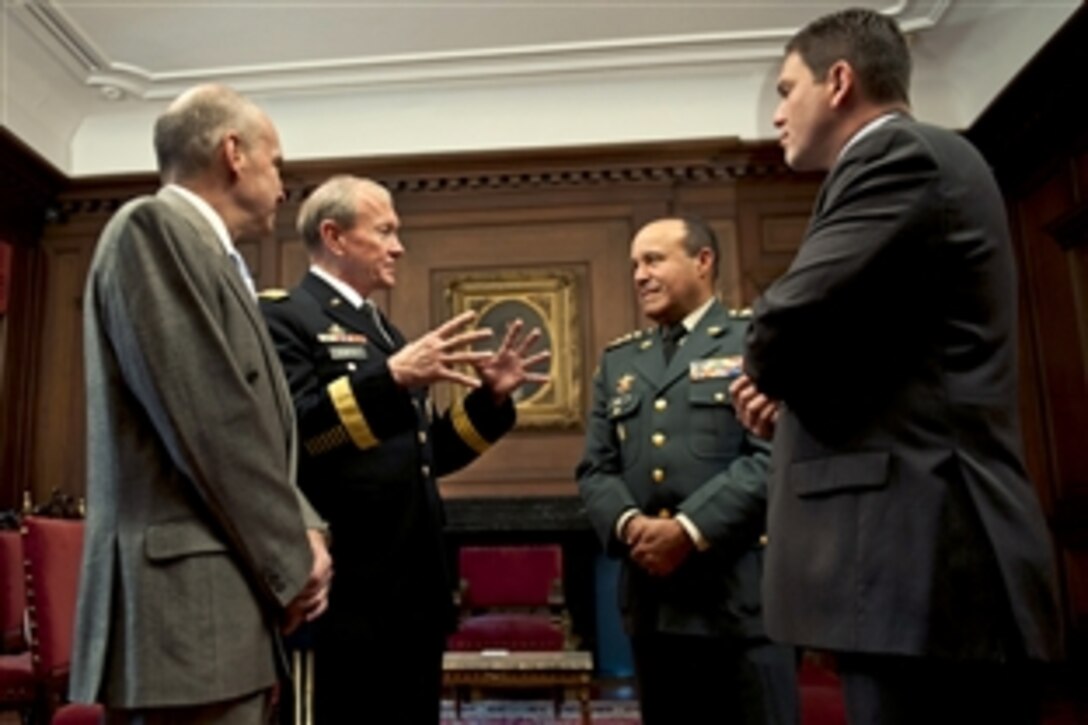 U.S. Army Gen. Martin E. Dempsey, second from left, chairman of the Joint Chiefs of Staff, speaks with P. Michael McKinley, far left, U.S. ambassador to Bogota, Colombia; Gen. Alejandro Navas, commander of Colombia's armed forces; and Colombian Defense Minister Juan Carlos Pinzon Bueno, right, at the Presidential Palace in Bogota, Colombia, March 27, 2012. Dempsey met with the Colombian officials to discuss finding ways to rebuild the country and maintain a partnership with the ally.
