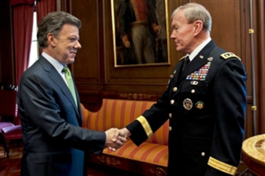 U.S. Army Gen. Martin E. Dempsey, chairman of the Joint Chiefs of Staff, meets with Colombian President Juan Manuel Santos Calderon at the Presidential Palace in Bogota, Colombia, March 27, 2012. Dempsey discussed ways to rebuild the country and maintain a partnership with the ally.