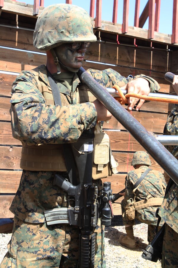 Recruit Harley J. York, Platoon 3221 guide, Company K, 3rd Recruit Training Battalion, completes an obstacle during the Crucible aboard Weapons and Field Training Battalion, Camp Pendleton, Calif. March 28. York joined the Marine Corps for the challenge and according to his drill instructors, has demonstrated a high level of leadership throughout recruit training.
