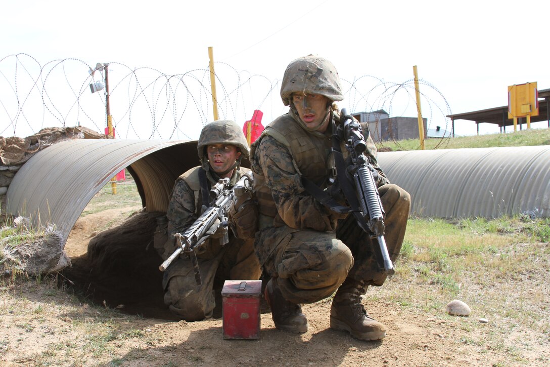 Recruit William Trump and Recruit Nicholas Sizemore, Company K, 3rd Recruit Training Battalion, move through tunnels and various other obstacles to complete Copeland's Assault at the Crucible aboard Edson Range, Camp Pendleton, Calif., March 28. Copeland's Assault is a simulated combat exercise where each fire team must carry an ammunition can to a resupply point.
