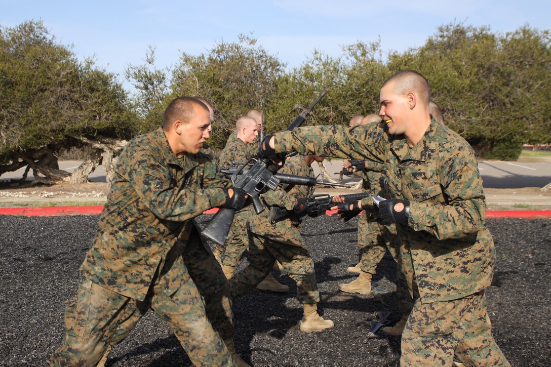 Company F recruits demonstrate counter to the over hand grab March 28 while testing out for their tan belt aboard Marine Corps Recruit Depot San Diego. To graduate boot camp all of the recruits must be proficient in Marine Corps Martial Arts Program tan belt moves while testing out.