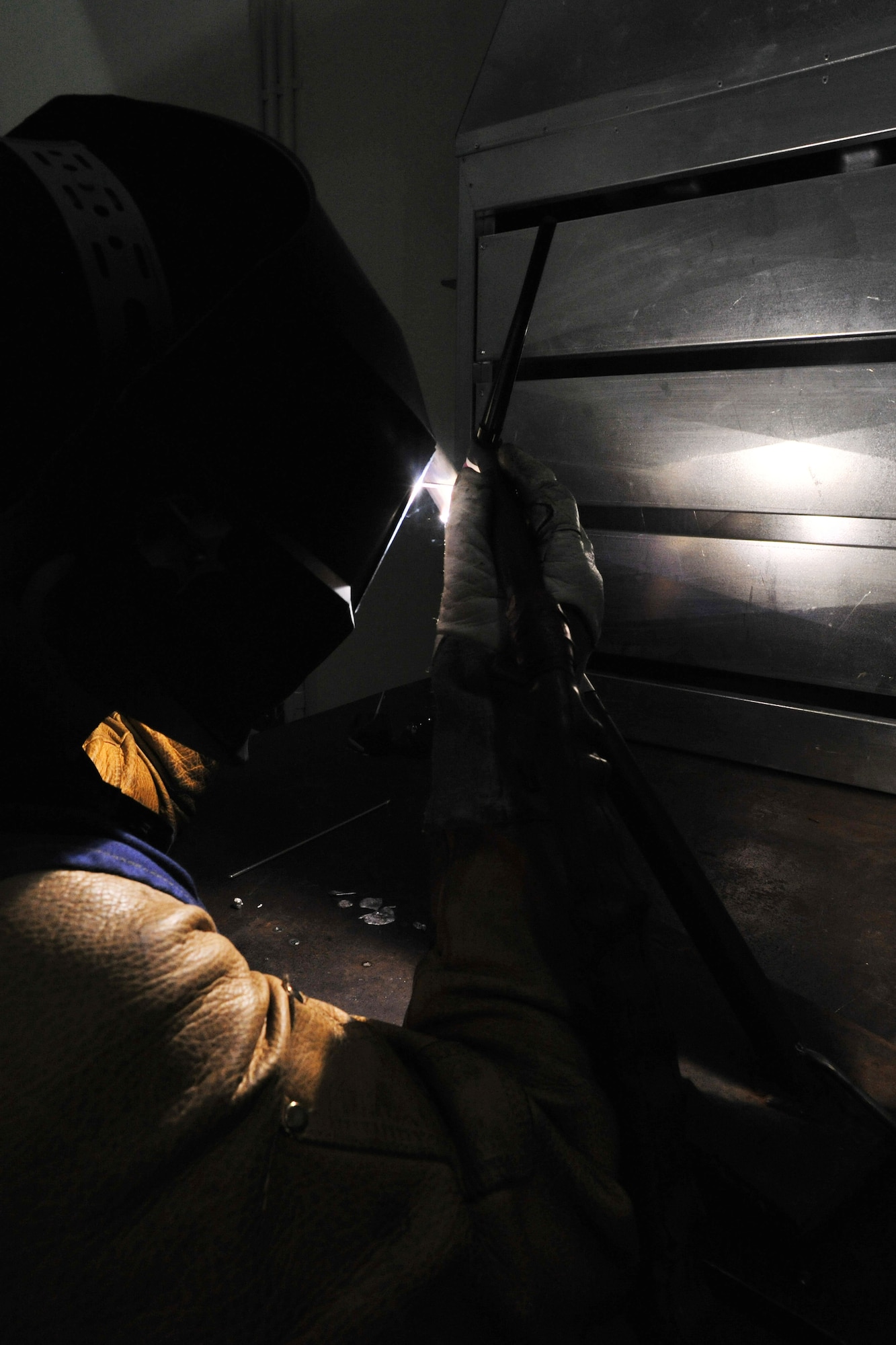 Senior Airman Jeffery Gaskins, 388th Expeditionary Maintenance Squadron aircraft metal technician, welds a piece of 6061 aluminum at Kunsan Air Base, Republic of Korea, March 29, 2012. Gaskin is deployed to the ROK from Hill Air Force Base, Utah, as part of Kunsan’s Theater Support Package. (U.S. Air Force photo/Senior Airman Brittany Y. Auld)