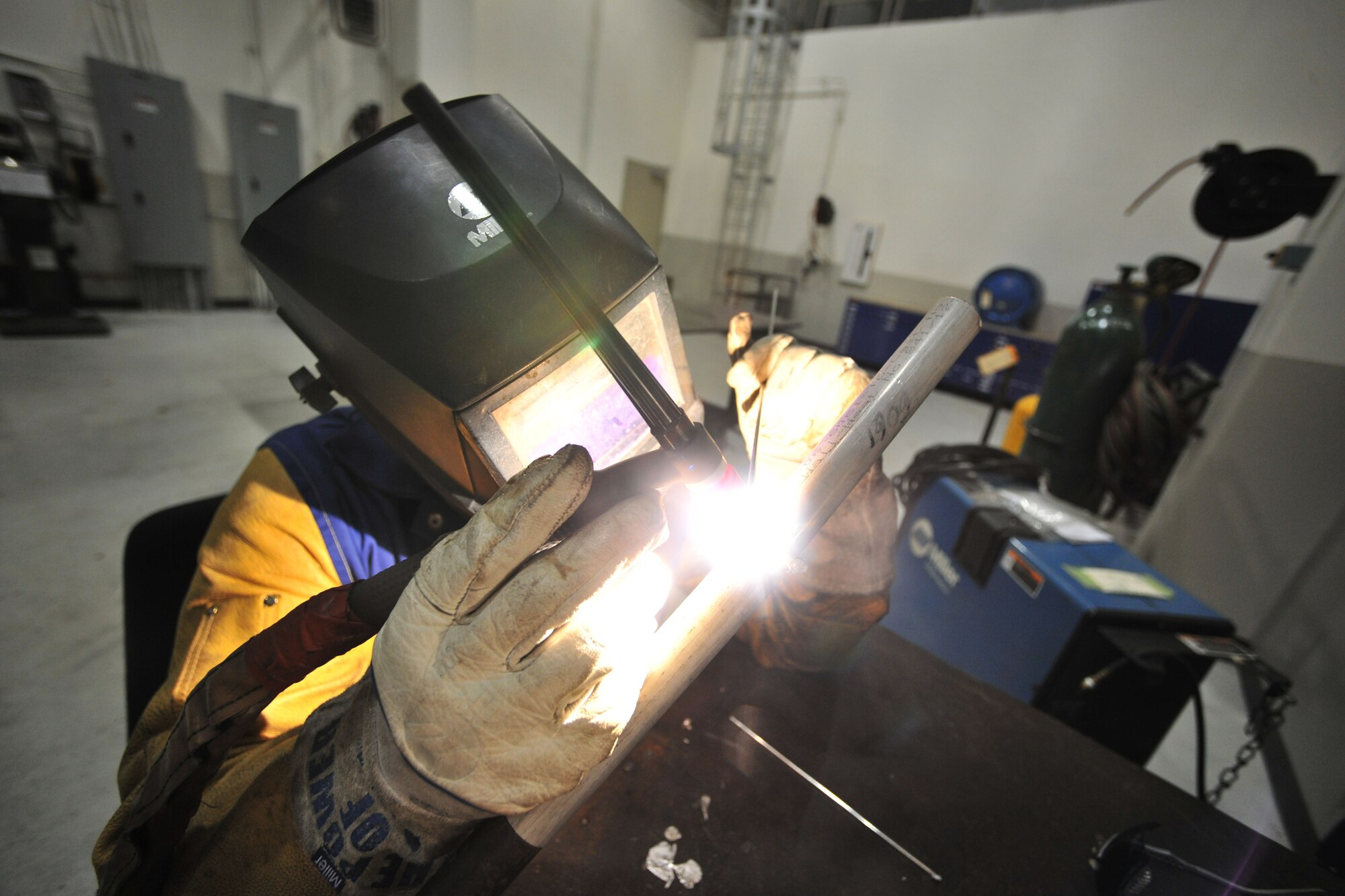 Senior Airman Jeffery Gaskins, 388th Expeditionary Maintenance Squadron aircraft metal technician, welds a piece of 6061 aluminum at Kunsan Air Base, Republic of Korea, March 29, 2012. Gaskin is deployed to the ROK from Hill Air Force Base, Utah, as part of Kunsan’s Theater Support Package. (U.S. Air Force photo/Senior Airman Brittany Y. Auld)