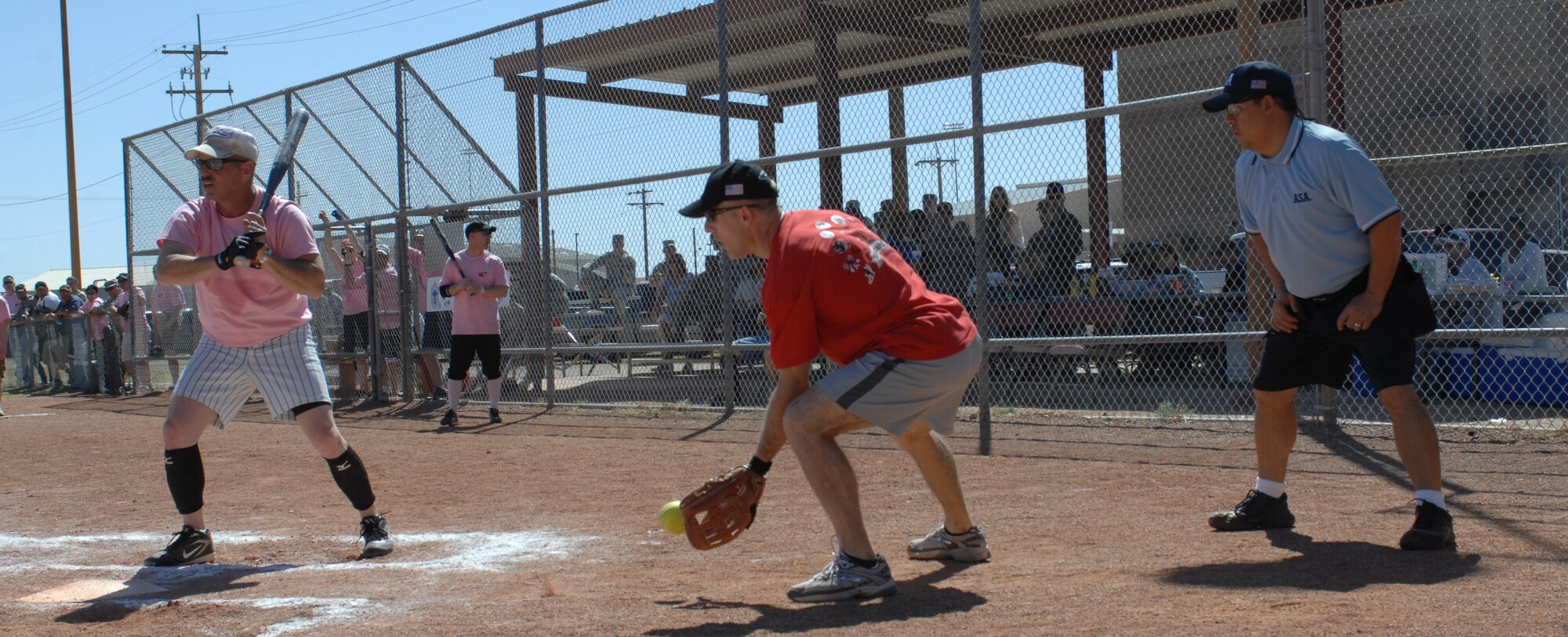 U.S. Air Force Col. John Cherry, 355th Fighter Wing commander, acts as catcher during the Chiefs vs. Eagles softball game at Thunderbolt Field on Davis-Monthan Air Force Base, Ariz., March 23. The Eagles took the victory over the Chiefs, with the final score being 15-14. (U.S. Air Force photo by Airman 1st Class Saphfire Cook/Released)