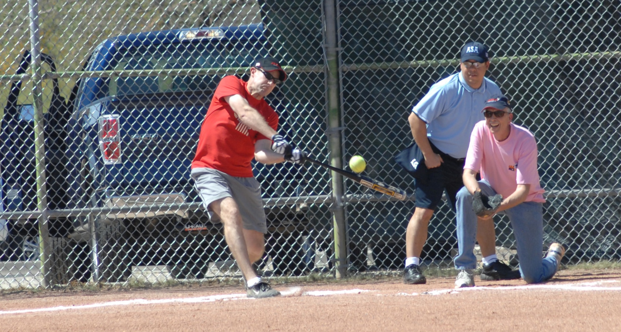 U.S. Air Force Lt. Col. Scott Campbell, 355th Operations Group deputy commander, clobbers the softball while up to bat at the Chiefs vs. Eagles softball game at Thunderbolt Field on Davis-Monthan Air Force Base, Ariz., March 23. The game is an annual charity event hosted by the Chief’s Group of D-M. (U.S. Air Force photo by Airman 1st Class Saphfire Cook/Released)