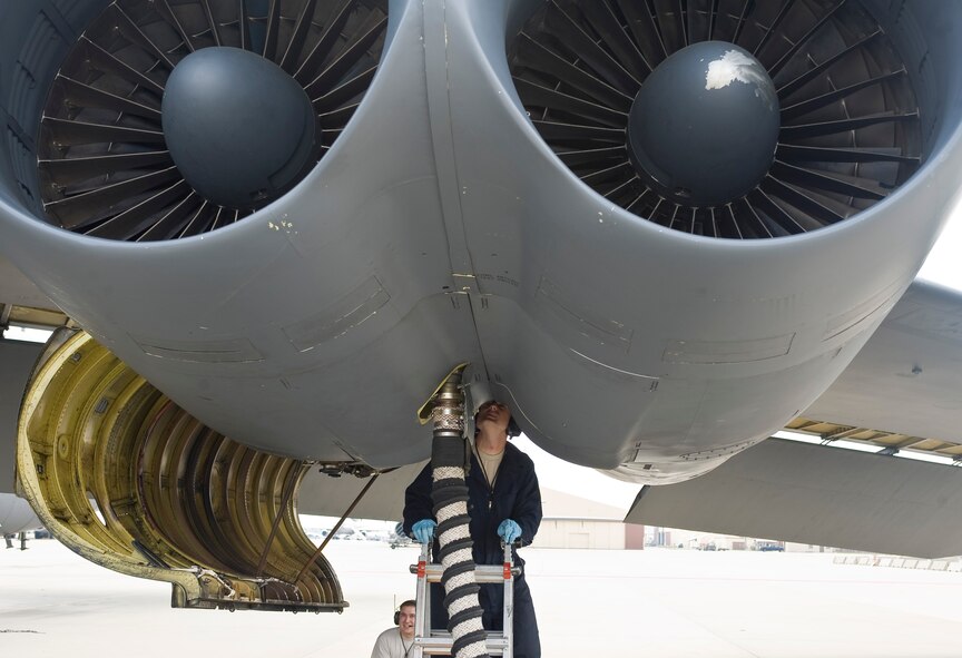 Tech. Sgt. Jason Gamble, 2nd Aircraft Maintenance Squadron crew chief, fixes safety wiring for a hydraulic quick disconnect hose on a B-52H Stratofortress engine on Barksdale Air Force Base, La., March 28. Airmen from the 2 AMXS routinely inspect and repair the aircraft, checking wiring, fluid levels and any other parts that may have discrepancies. (U.S. Air Force photo/Senior Airman Chad Warren)(RELEASED)