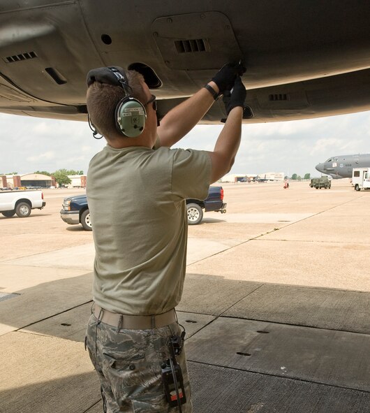 Staff Sgt. Kevin Henchey, 2nd Aircraft Maintenance Squadron crew chief, closes a panel on a B-52H Stratofortress engine on Barksdale Air Force Base, La., March 28. Crew chiefs are required to be qualified on more than 250 tasks to ensure the aircraft is in top condition. (U.S. Air Force photo/Senior Airman Chad Warren)(RELEASED)