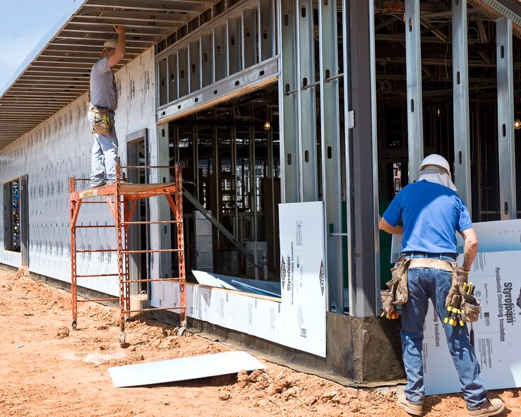 Construction workers hang drywall at the new Child Development Center expansion on Barksdale Air Force Base, La., March 27. The new expansion will add eight rooms to the CDC and nearly double the center's capacity. (U.S. Air Force photo/Senior Airman Chad Warren)(RELEASED)