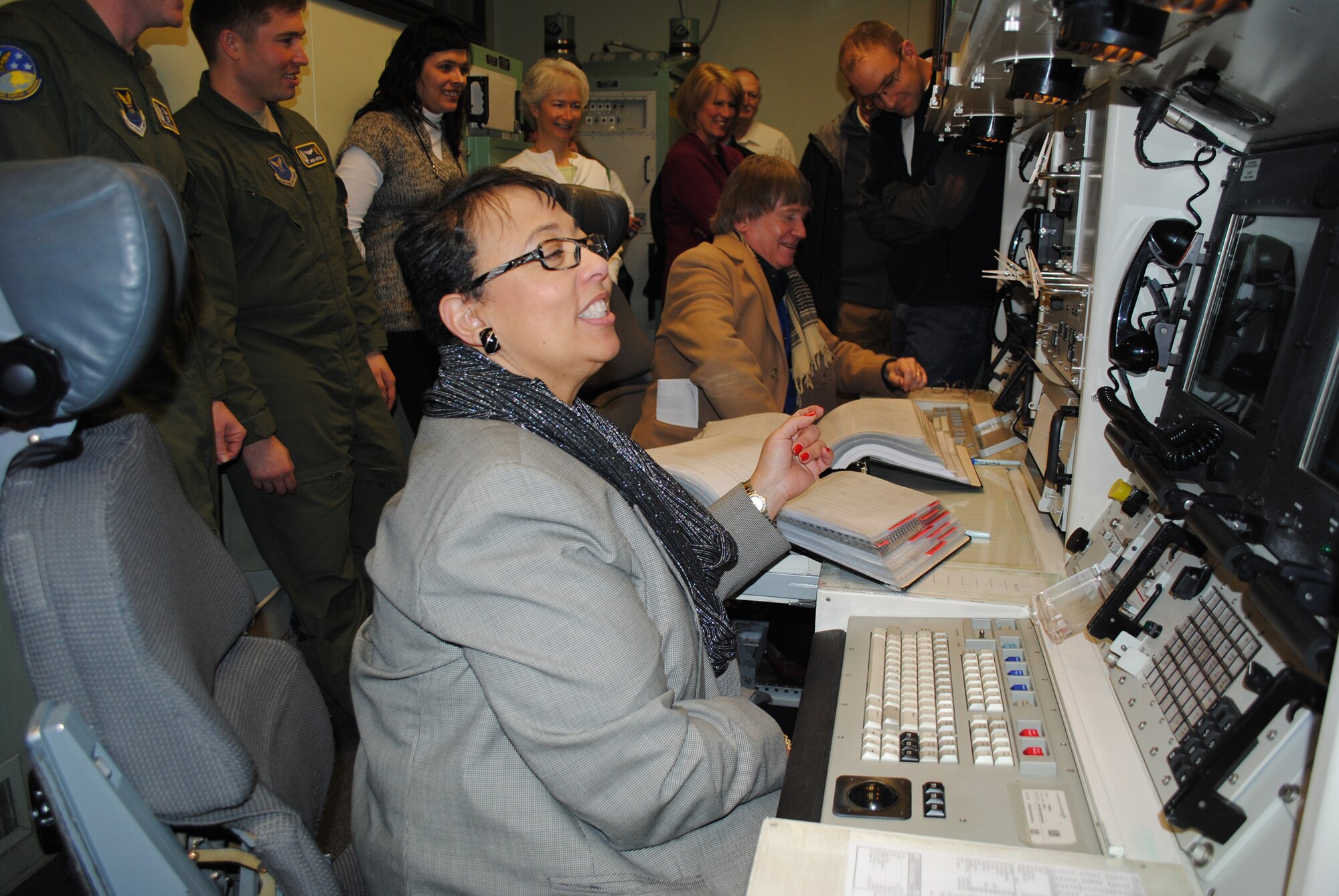 Dr. Gwen Joseph, left, MSU-Great Falls College of Technology interim dean, amd William Bronson, Great Falls city commissioner, prepare to simulate a key turn in the MPT. (U.S. Air Force photo/Airman 1st Class Katrina Heikkinen
