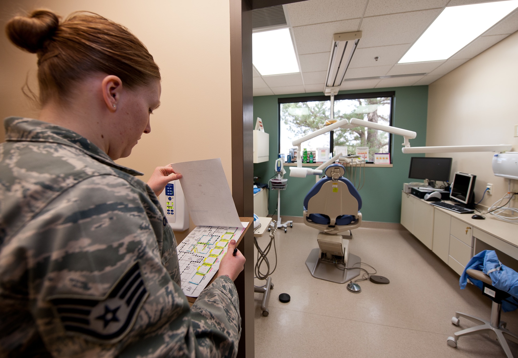 Staff Sgt. Kathleen Couillard, 28th Medical Operations Squadron bio-environmental engineering technician, determines specific testing locations during a radiation scatter survey at the dental clinic on Ellsworth Air Force Base, S.D., March 27, 2012. Data from these tests is recorded and processed by bio-environmental engineering technicians, who ensure facilities are free from harmful radiation. (U.S. Air Force photo by Airman 1st Class Kate Thornton/Released)