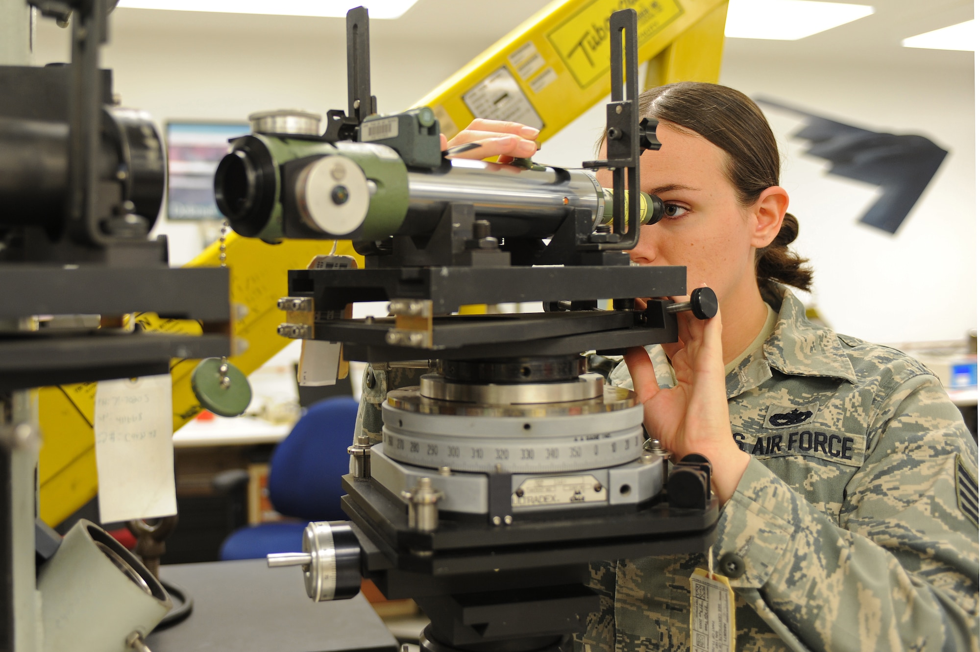 U.S. Air Force Staff Sgt. Amy Loving calibrates optics on a target cell in the precision measurement equipment laboratory on Seymour Johnson Air Force Base, N.C., March 28, 2012. The cell assists with targeting and attaches to a target adapter on the weapon systems of an F-15E Strike Eagle. Loving, 4th Component Maintenance Squadron NCO in charge of training, is from Goldsboro, N.C. (U.S. Air Force photo/Airman 1st Class John Nieves Camacho/Released)