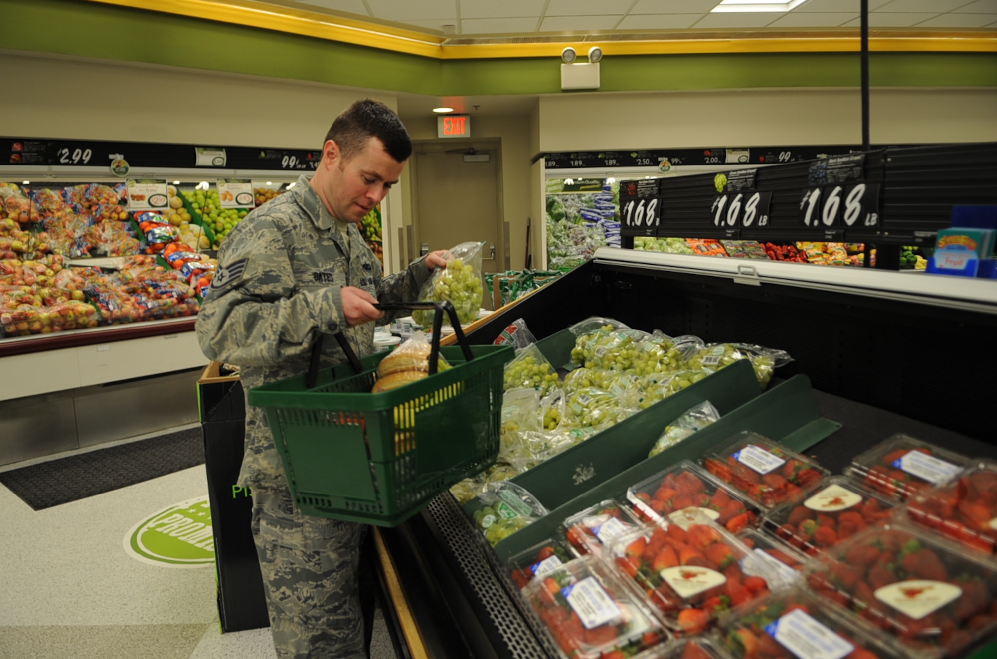 U.S. Air Force Staff Sgt. Richard Oates shops for grapes at the commissary on Seymour Johnson Air Force Base, N.C., March 29, 2012. Oates makes eating healthy easier by portioning grapes into snack bags to eat on-the-go. Oates, a 4th Force Support Squadron food service supervisor, hails from Catskill, N.Y. (U.S. Air Force photo/Airman 1st Class Aubrey Robinson/Released)