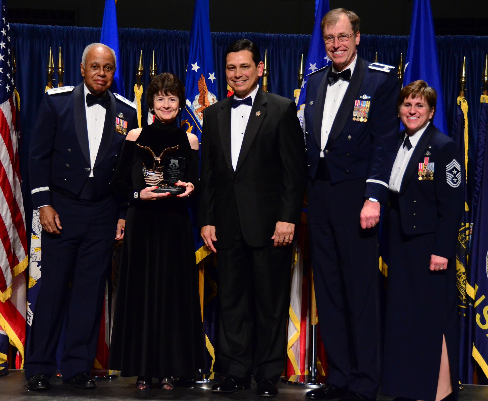 WRIGHT-PATTERSON AIR FORCE BASE, Ohio - Mrs. Sue Ellen Ater, president of the Miami Valley Military Affairs Association, accepts the 445th Airlift Wing Community Partner of the Year award on behalf of the MVMAA during the 445th AW Annual Awards Banquet March 3. The MVMAA was selected for this award for demonstrating effective and sustained relationships with wing leadership and wing members and their families. (U.S. Air Force photo/Senior Airman Mikhail Berlin)