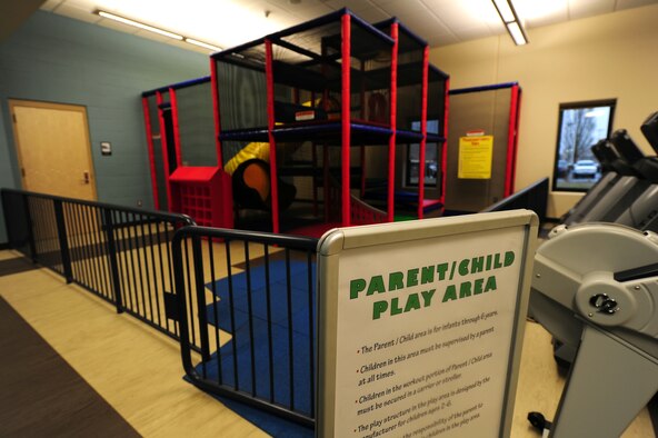 The new fitness center offers a parent and child play area so the parents of children can work out and watch their kids at the same time. The play structure in the play area is designed by for children ages 2-6 and all children must be supervised at all times. (U.S. Air Force photo by Airman 1st Class Taylor Curry)                     