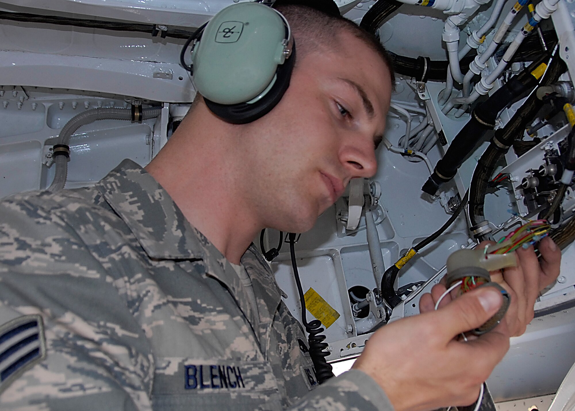Senior Airman Alexander Blench, an avionics specialist with the 46th Maintenance Squadron at Eglin Air Force Base, Fla., performs modifications to improve reliability of inlet ramp scheduling on the F-15 E model.  Blench recently won the 2011 Lt. Gen. Leo Marquez award for maintenance excellence in the technical category. (U.S. Air Force photo/Kevin Gaddie)