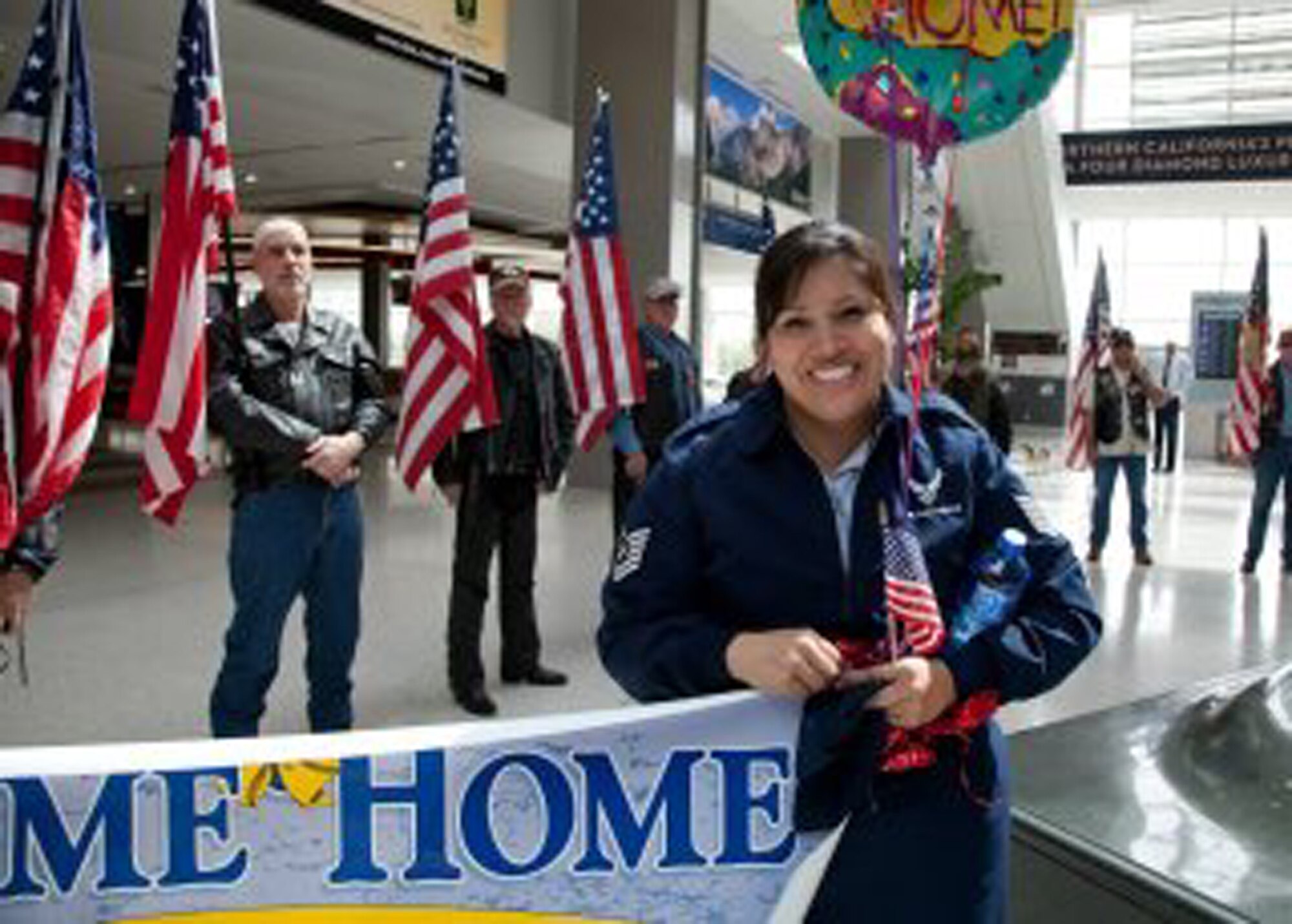 TRAVIS AIR FORCE BASE, Calif. -- Air Force Reservists are welcomed home from Afghanistan by friends, family and members of the Patriot Guard Riders at Sacramento International Airport, Calif., Mar. 26, 2012. The Reservists had been deployed for six months in support of Operation Enduring Freedom. (U.S. Air Force photo / Lt. Col. Robert Couse-Baker) AFRC— at Sacramento International Airport.