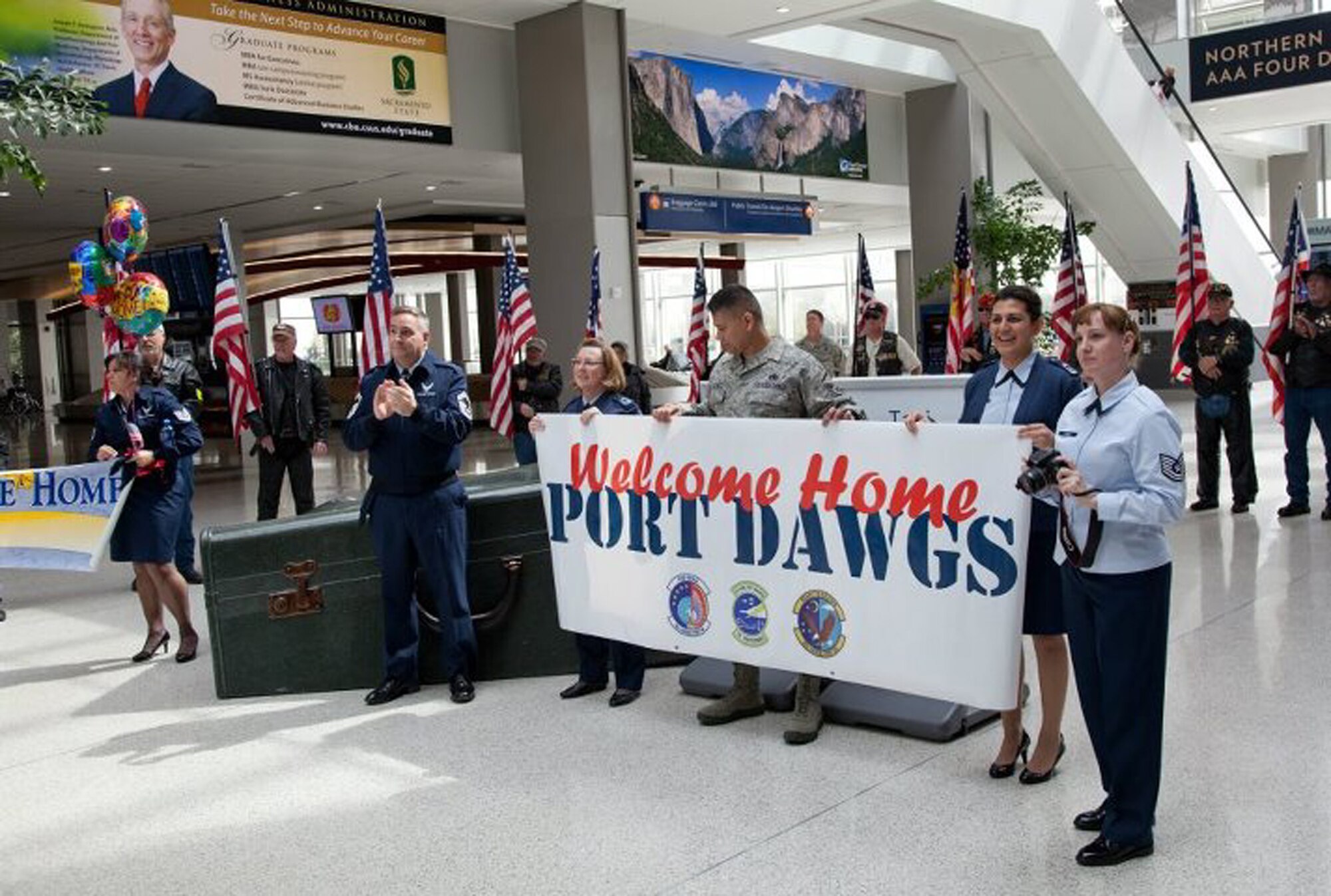 TRAVIS AIR FORCE BASE, Calif. -- Air Force Reservists are welcomed home from Afghanistan by friends, family and members of the Patriot Guard Riders at Sacramento International Airport, Calif., Mar. 26, 2012. The Reservists had been deployed for six months in support of Operation Enduring Freedom. (U.S. Air Force photo / Lt. Col. Robert Couse-Baker) AFRC— at Sacramento International Airport.