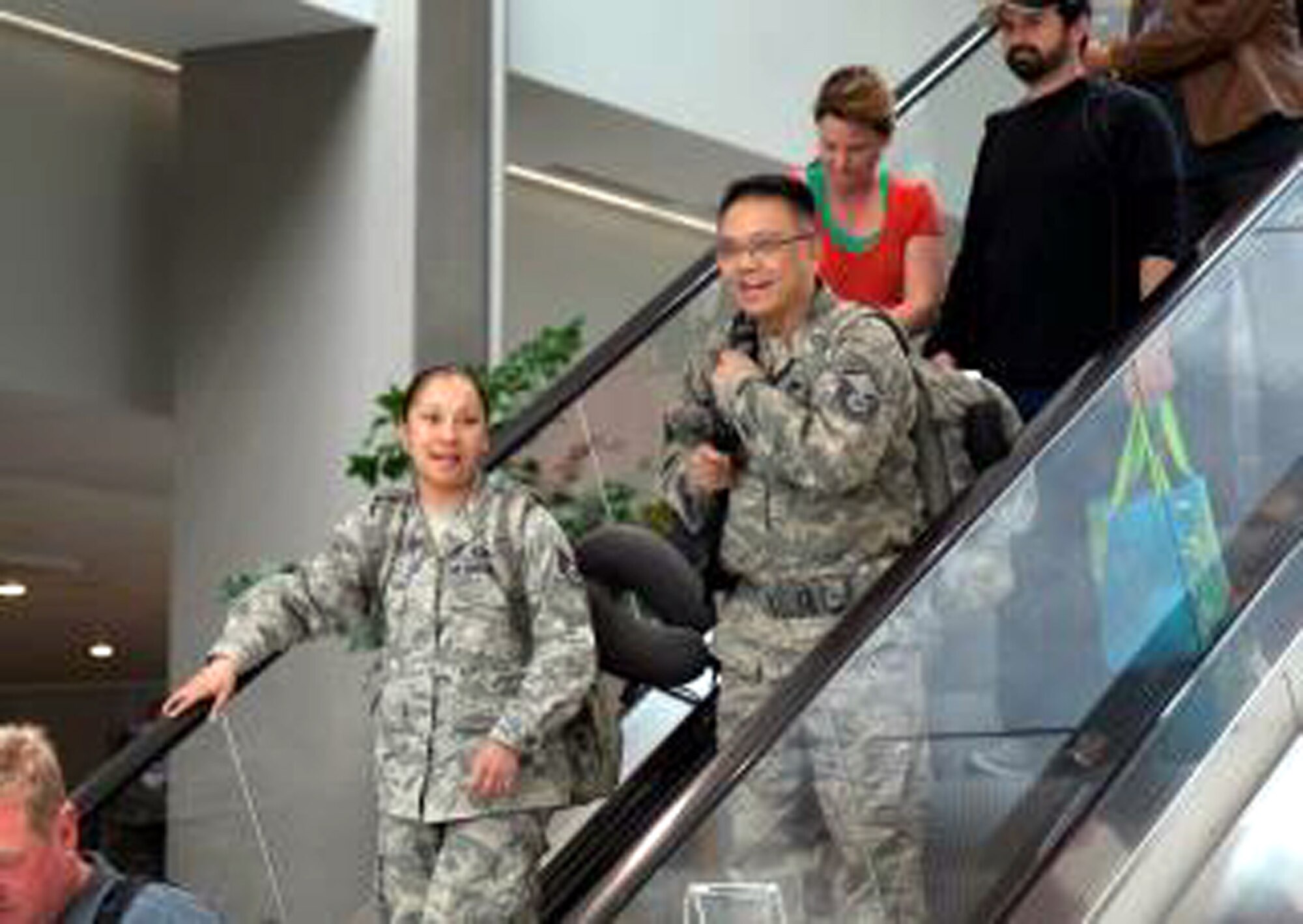 TRAVIS AIR FORCE BASE, Calif. -- Air Force Reservists Senior Airman Silvania Raposo and Master Sgt. Emmanuel Basco are welcomed home from Afghanistan by friends, family and members of the Patriot Guard Riders at Sacramento International Airport, Calif., Mar. 26, 2012. Raposo is assigned to the 940th Force Support Squadron, 940th Wing, Beale Air Force Base. Basco is assigned to the 82nd Aerial Port Squadron, 349th Air Mobility Wing, Travis Air Force Base. The Reservists had been deployed for six months in support of Operation Enduring Freedom. (U.S. Air Force photo / Lt. Col. Robert Couse-Baker) AFRC— at Sacramento International Airport.