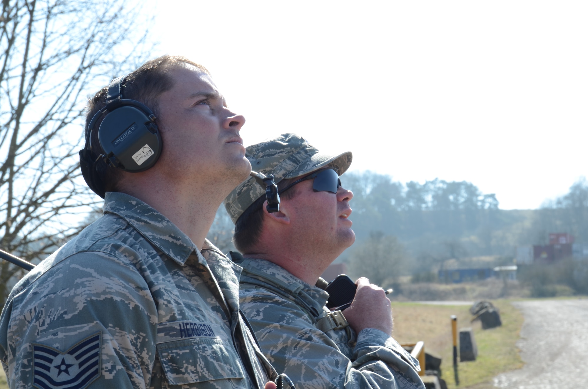Joint Tactical Air Controller instructor, Tech. Sgt. Clinton Herbison, and student, Lt. Col. Zachary A. Wood, watch for planes called in during training in Baumholder, Germany March 21. (U.S. Air Force photo/ 2nd Lt. Kay M. Nissen)
