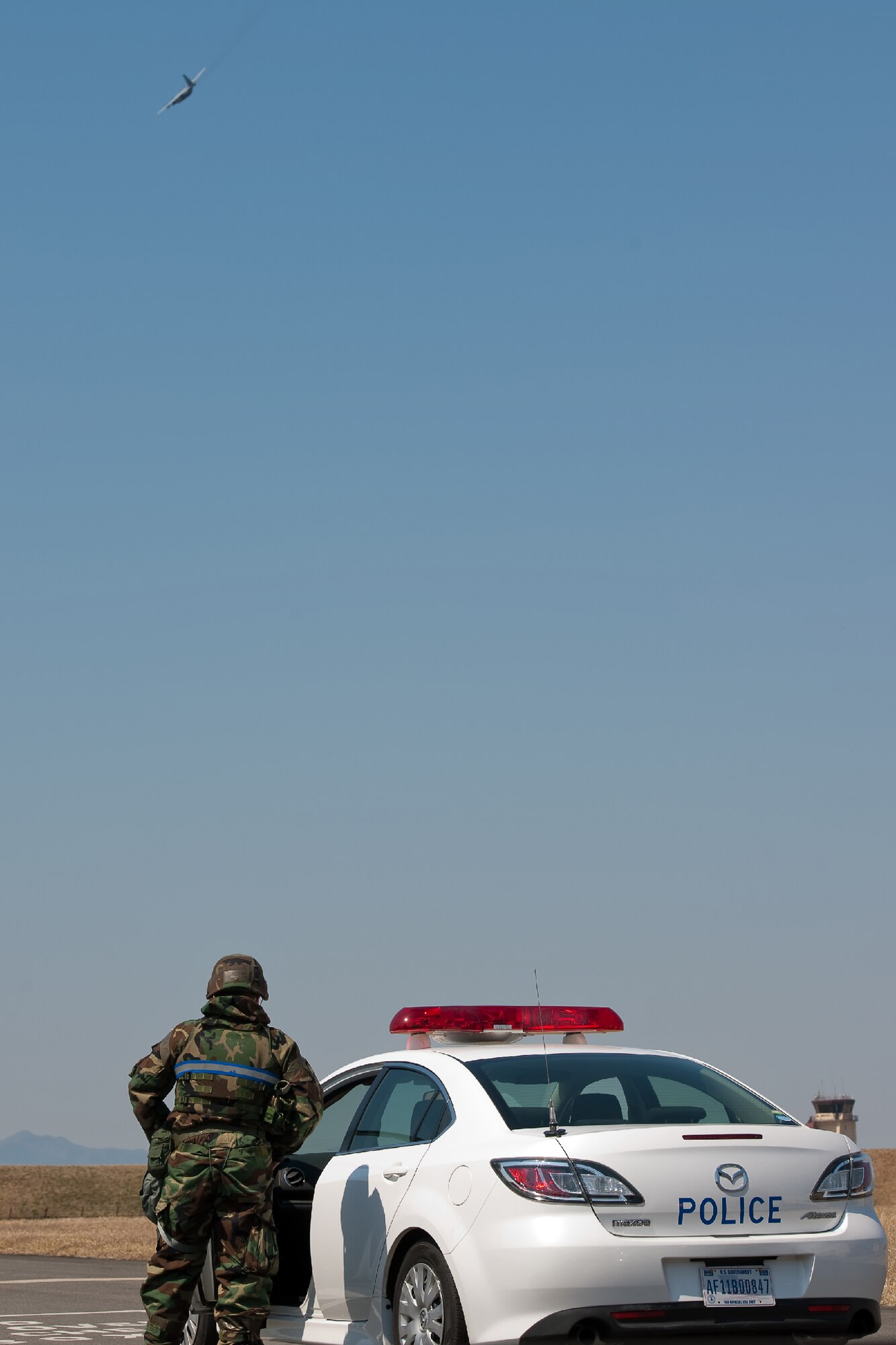 YOKOTA AIR BASE, Japan -- Senior Airman Trevor Port, 374th Security Forces augmentee, patrols the flightline at Yokota Air Base, Japan, March 27, 2012. Airmen at Yokota participate in exercises to maintain their operational readiness capabilities. (U.S. Air Force photo/Osakabe Yasuo)