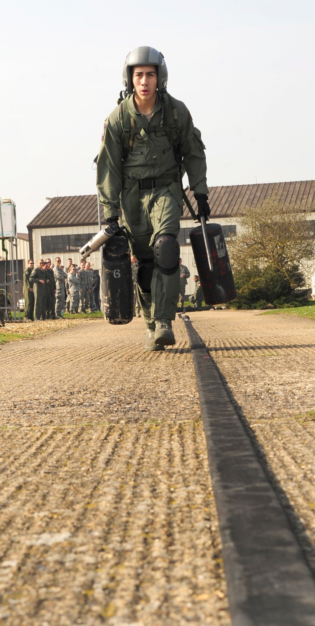 RAF MILDENHALL, England – Airman 1st Class Jorge Martinez, 100th Logistics Readiness Squadron fuels apprentice, demonstrates a portion of the Forward Area Refueling Point qualification course here March 23, 2012. The 100th LRSFARP team currently consists of nine Airmen and is one of only five teams Air Force-wide. (U.S. Air Force photo/Senior Airman Ethan Morgan)