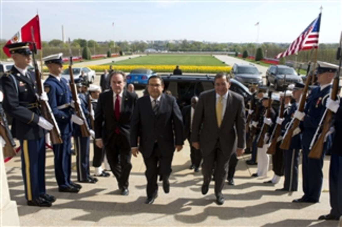 Secretary of Defense Leon E. Panetta hosts an honor cordon for the Minister of Defense of Peru Luis Alberto Otarola Penarand (center) and the Peruvian Ambassador Harold W. Forsyth (left) at the Pentagon on March 28, 2012.  