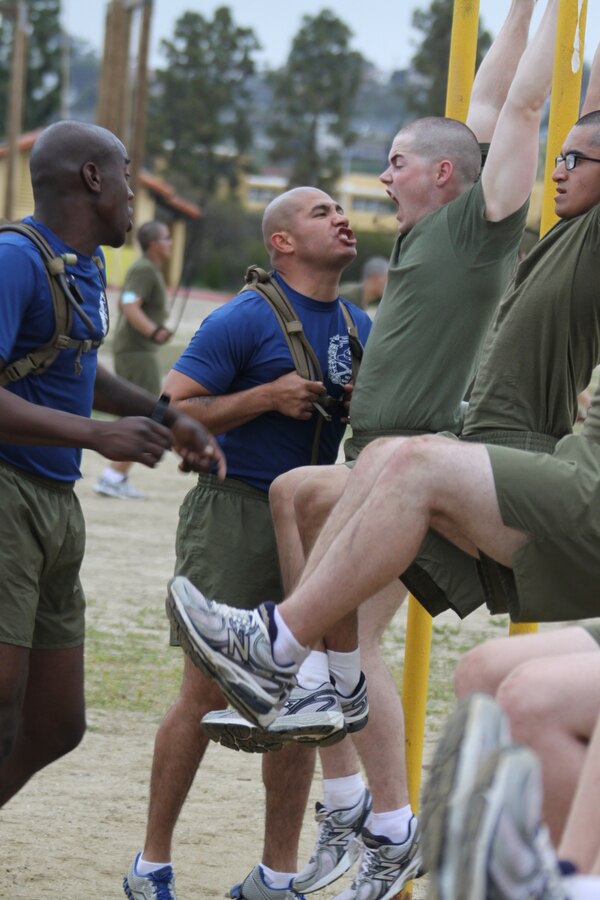 Company I  drill instructors motivate their recruits while they perform leg lifts aboard Marine Corps Recruit Depot San Diego March 29. Leg lifts were one of the 14 different stations Co. I endured on the curcuit course after getting their heart rates up with two-and-a-half miles.