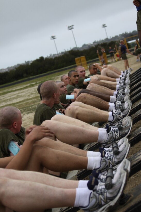 Recruits from Company I perform crunches as part of the circuit course aboard Marine Corps Recruit Depot San Diego March 29. Co. I completed 14 different stations after running two-and-a-half miles to help get the recruits in shape.
