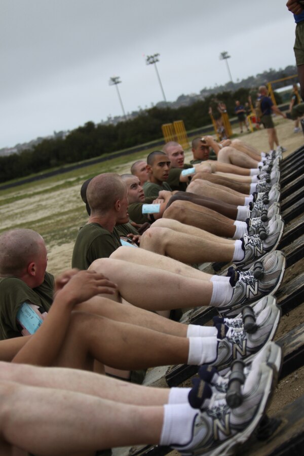 Recruits from Company I perform crunches as part of the circuit course aboard Marine Corps Recruit Depot San Diego March 29. Co. I completed 14 different stations after running two-and-a-half miles to help get the recruits in shape.