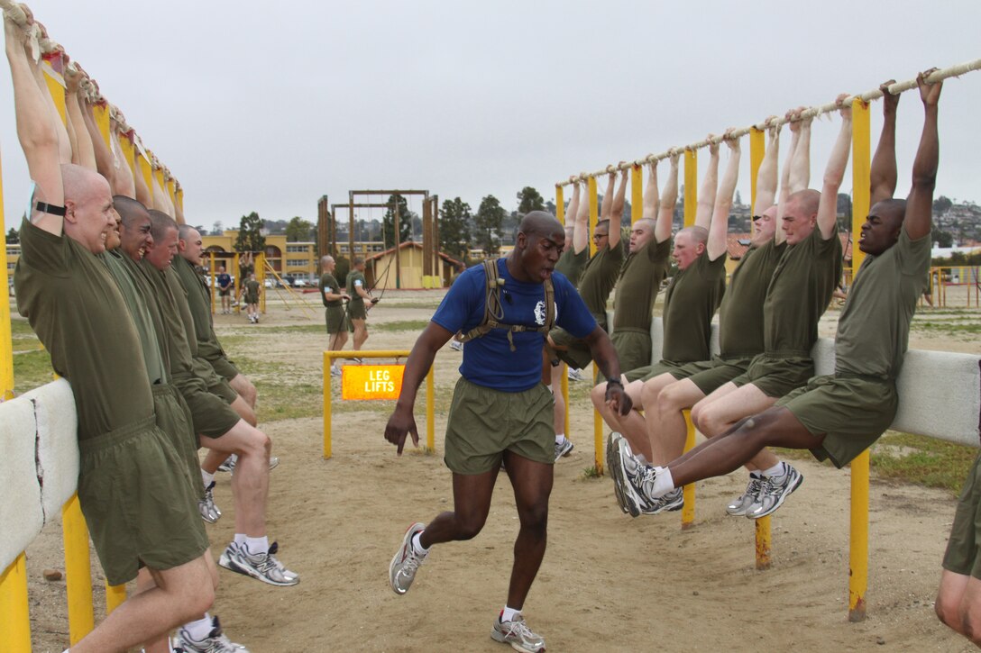 Company I  drill instructors motivate their recruits while they perform leg lifts aboard Marine Corps Recruit Depot San Diego March 29. Leg lifts were one of the 14 different stations Co. I endured on the curcuit course after getting their heart rates up with two-and-a-half miles.
