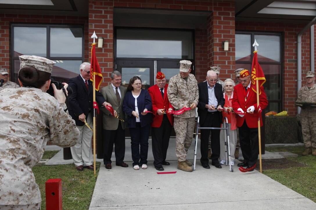 Marines, family and friends join together for a ribbon cutting of a new bachelor enlisted quarters named Loweranitis Hall, named after Cpl. John “Jack” Loweranitis, who paid the ultimate sacrifice 45 years ago during the Battle of Getlin’s Corner in the Republic of Vietnam, March 30.