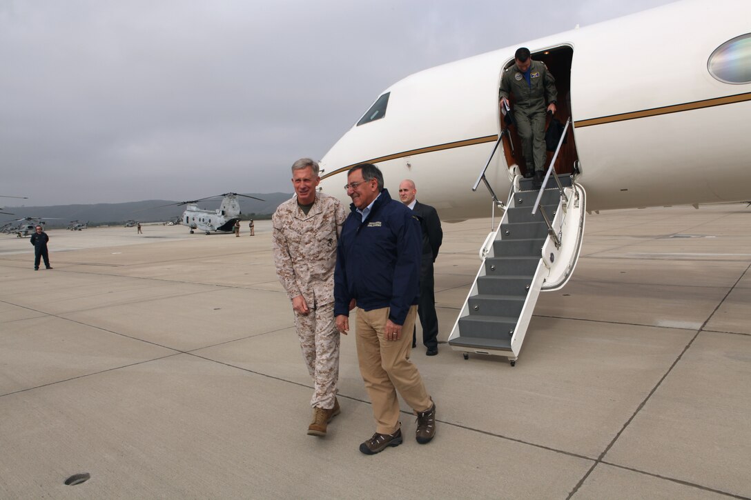 Lt. Gen. Thomas D. Waldhauser, the commanding general of I Marine Expeditionary Force, greets Defense Secretary Leon Panetta at the Marine Corps Air Station Camp Pendleton, Calif., March 30.  Secretary Panetta will board a hovercraft to visit Marines and sailors aboard the U.S.S. Peleliu operating off the coast of California.