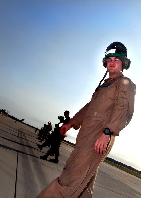 Sgt. Matthew E. Crowder, an avionics technician with VMAT-203, searches for FOD on the flight line outside of VMAT-203’s hangar Friday.
