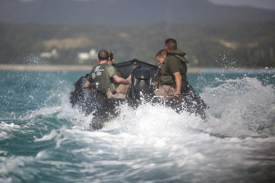 Marines with Combat Assault Battalion pilot a combat rubber raiding craft on their way to Kushi Crossing off the coast of Camp Schwab March 30. Kushi Crossing is where CAB lands its amphibious assault vehicles when entering the central training area. The Marines performed a reconnaissance of the nearby coral reef to ensure they can safely and accurately navigate the waters while using amphibious assault vehicles. CAB is part of 3rd Marine Division, III Marine Expeditionary Force.