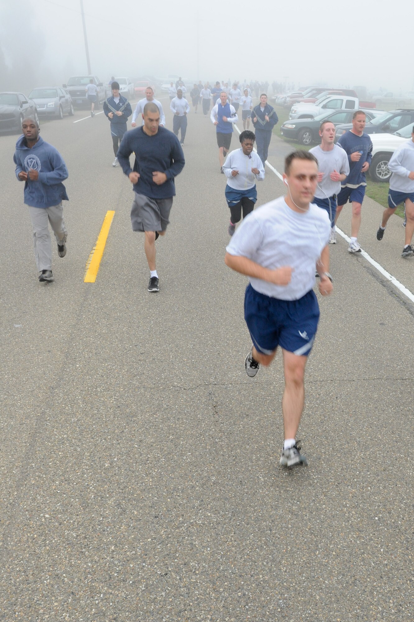 VANDENBERG AIR FORCE BASE, Calif. -- Team V members run during the monthly Fit-to-Fight Run here Friday, March 20, 2012. Runners were encouraged to wear blue and teal T-shirts, representing Child Abuse Awareness Month and Sexual Assault Awareness Month respectively. Various events will be held for both causes throughout the month, contact the sexual assault response coordinator and family advocacy office for more details.  (U.S. Air Force photo/Staff Sgt. Levi Riendeau)