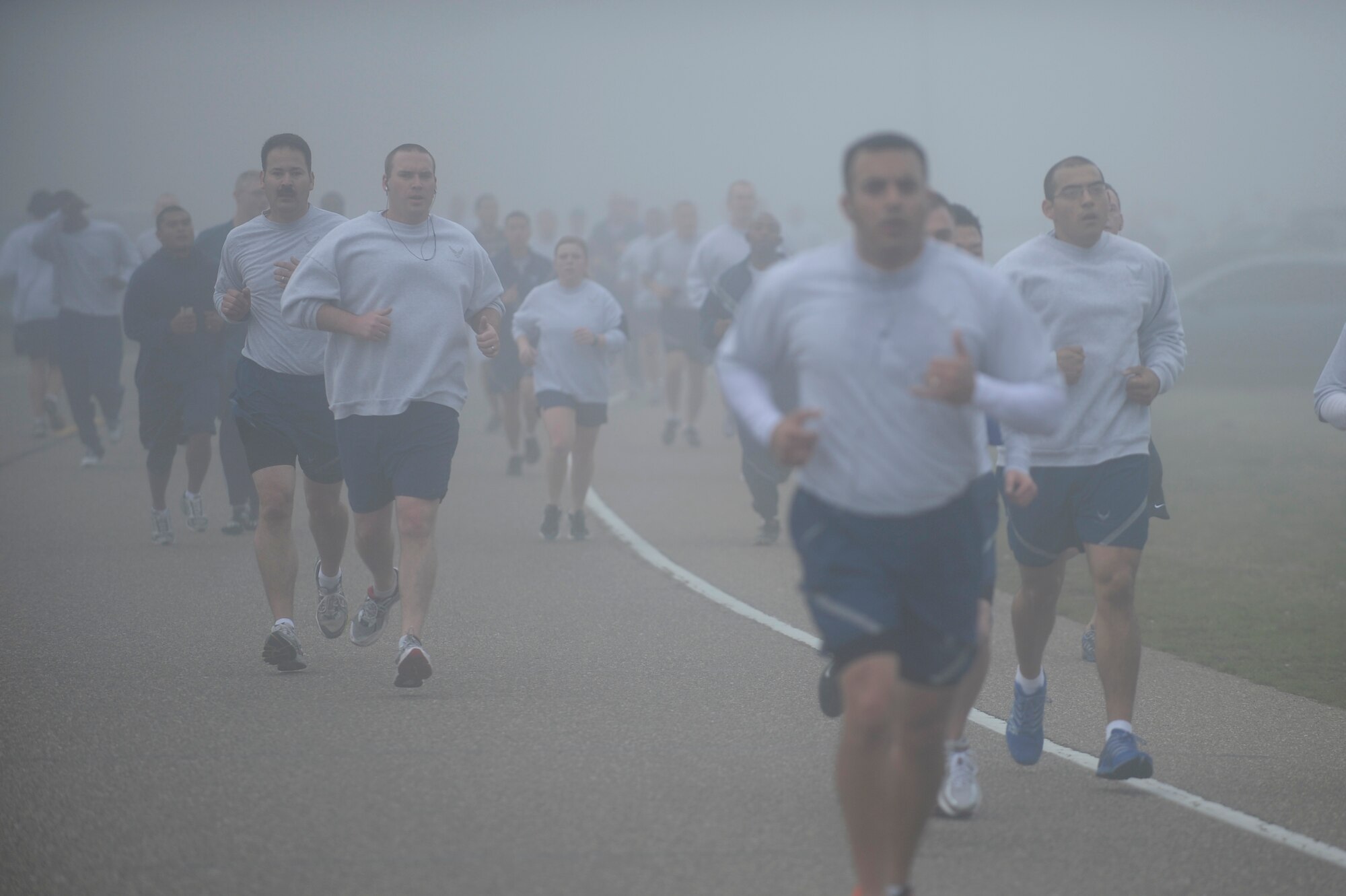 VANDENBERG AIR FORCE BASE, Calif. -- Team V members run during the monthly Fit-to-Fight Run here Friday, March 20, 2012. Runners were encouraged to wear blue and teal T-shirts, representing Child Abuse Awareness Month and Sexual Assault Awareness Month respectively. Various events will be held for both causes throughout the month, contact the Sexual Assault Coordinator Response and Family Advocacy office for more details. (U.S. Air Force photo/Staff Sgt. Andrew Satran)
