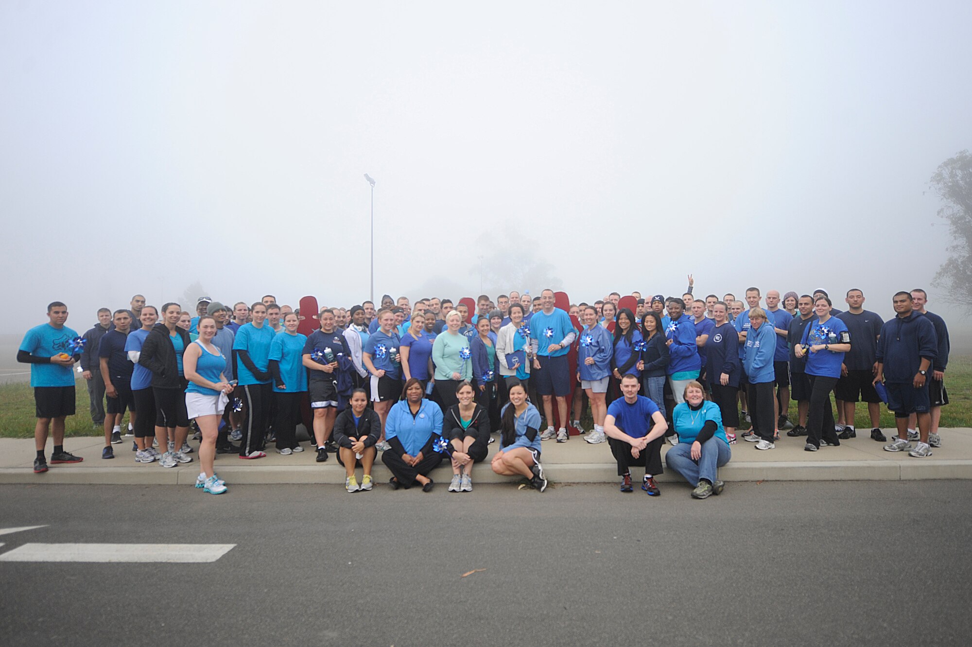 VANDENBERG AIR FORCE BASE, Calif. -- Team V members pose for a photo during the monthly Fit-to-Fight Run here Friday, March 20, 2012. Runners were encouraged to wear blue and teal T-shirts, representing Child Abuse Awareness Month and Sexual Assault Awareness Month respectively. Various events will be held for both causes throughout the month, contact the Sexual Assault Coordinator Response and Family Advocacy office for more details. (U.S. Air Force photo/Staff Sgt. Andrew Satran)
