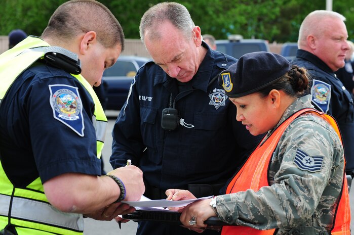 U.S. Air Force Technical Sgt. Sheery Moos, 99th Security Forces Squadron instructor evaluator, briefs local law enforcement members on the Multi Assault Counter Terrorism Action Capabilities training exercise March 28, 2012, at Nellis Air Force Base, Nev. MACTAC training enabled participants to immediately deploy a contact team to locate, move to and neutralize violent assaults and or terrorist acts. (U.S. Air Force photo by Staff Sgt. William P.Coleman)  