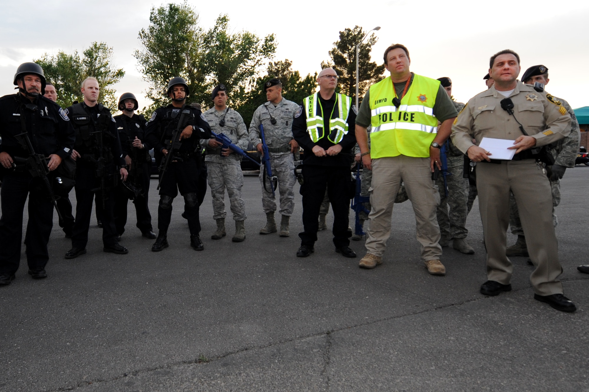 Members of the Las Vegas Metro Police Department, North Las Vegas Police Department and 99th Security Forces Squadron listen to instruction during the Multi Assault Counter Terrorism Action Capabilities training at Lomie Heard Elementary School March 28, 2012, at Nellis Air Force Base, Nev.  The training educated base personnel (active duty, dependant, civilian, and contractor) on real world threats that could affect them and their families.  (U.S. Air Force photo by Staff Sgt. William P.Coleman)
  

