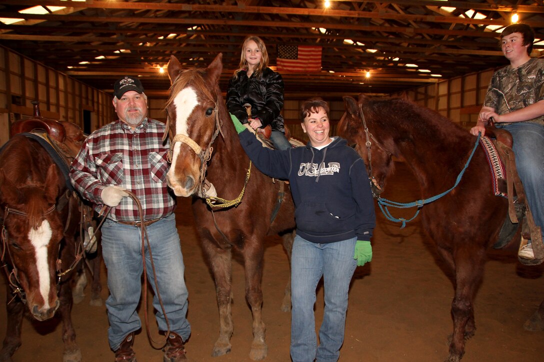 From left, Odee, Clint Cullum,  daughter, Montana (riding Lumpy), Master Sgt. Shana Cullum, and their son, Shields on Top.  The Cullums raise and train horses for a living in southwest Illinois.  (U.S. Air Force photo/Tech. Sgt. Dan Oliver) 